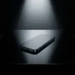 Sleek smartphone on a dark reflective surface representing mobile cybersecurity threats.